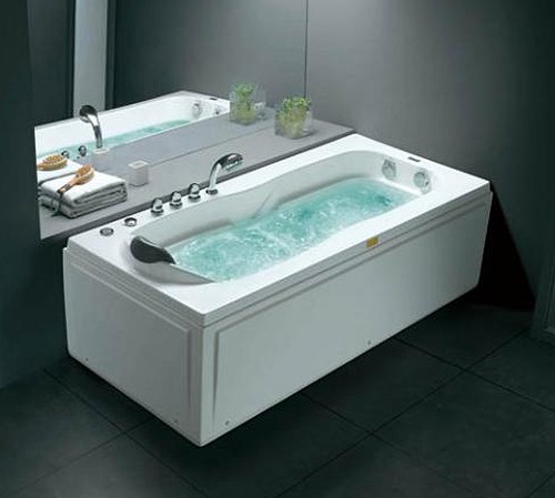 Example image of Hydra Corner whirlpool Bath With Bath Panels. 1710x830 (Right Handed).