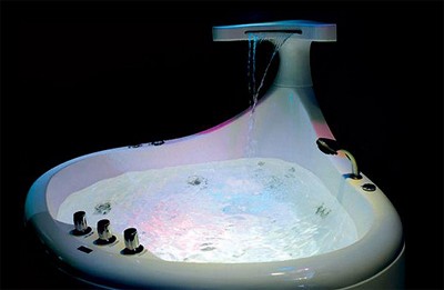 Example image of Hydra Whale Corner Whirlpool Bath With Waterfall Shower. 1500x1500mm.